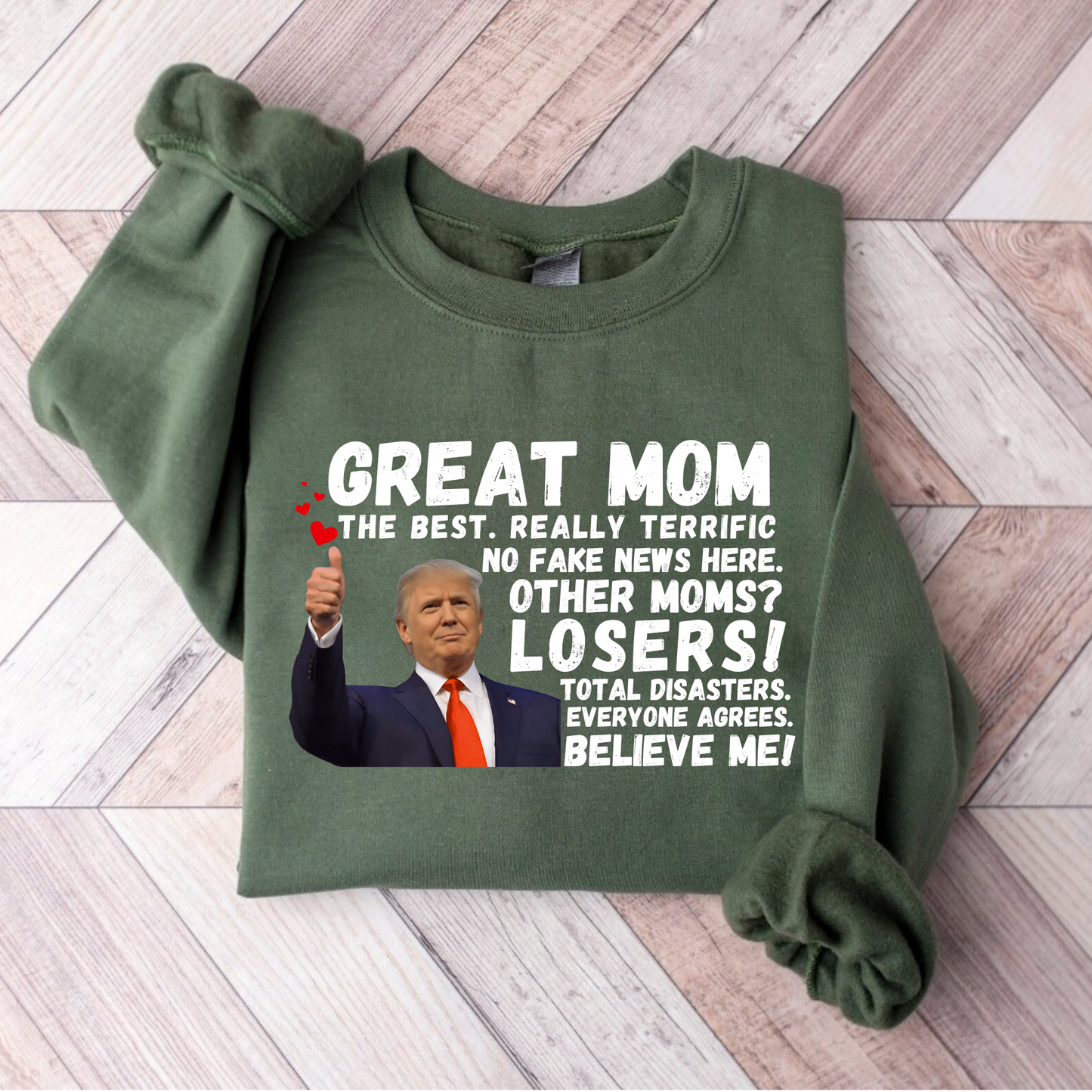 Show your mom she’s the best with this hilarious Great Mom Trump Sweatshirt! Featuring bold text and an iconic thumbs-up image, this design plays on a famous speech style, making it a funny, patriotic, and conservative-friendly gift for Mother’s Day, birthdays, or just because.