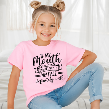 Young child lounging in light pink graphic t-shirt
