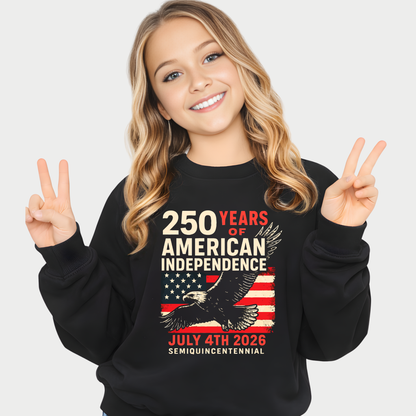 Young girl wearing 250 Years of American Independence patriotic sweatshirt making peace sign and smiling