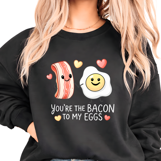 black valentine sweatshirt featuring you’re the bacon to my eggs playful bacon and egg love design