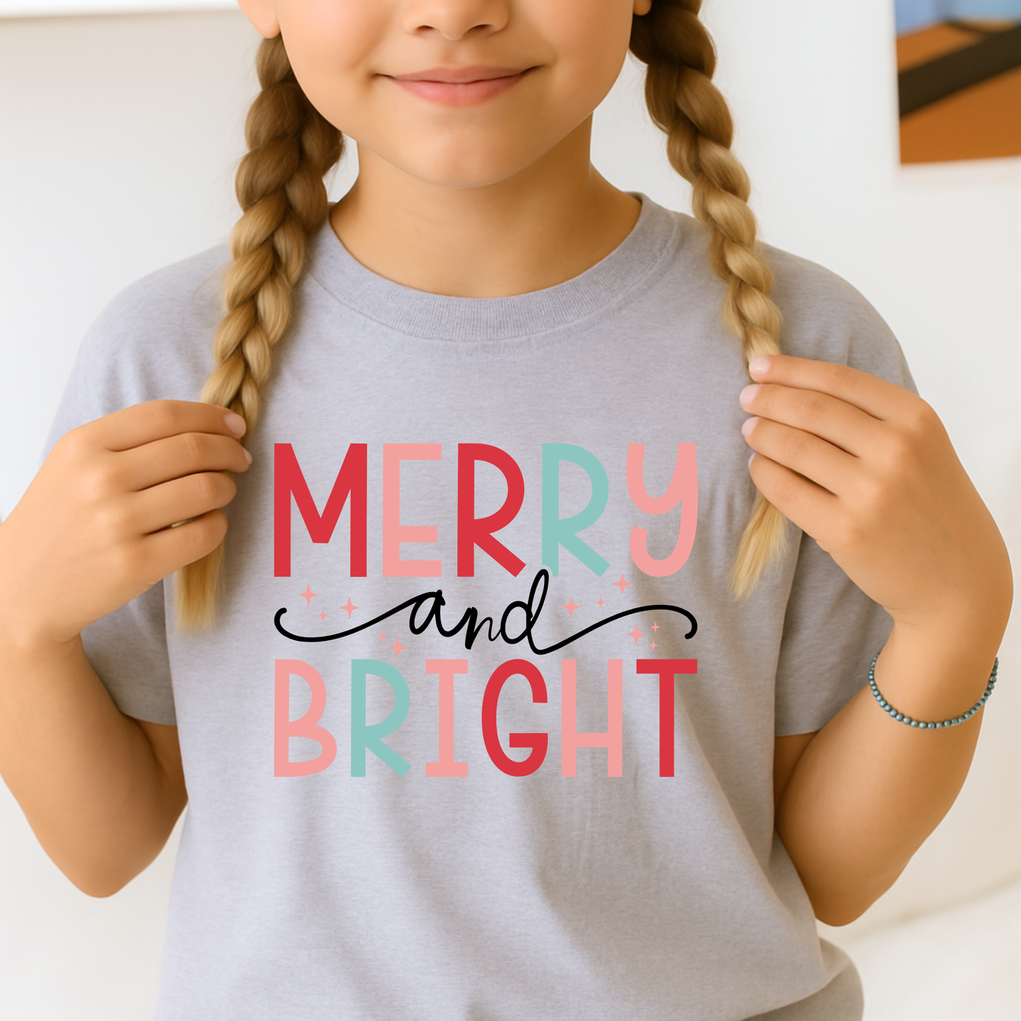 Young Girl wearing a sports gray Merry and Bright Christmas Sweatshirt. 