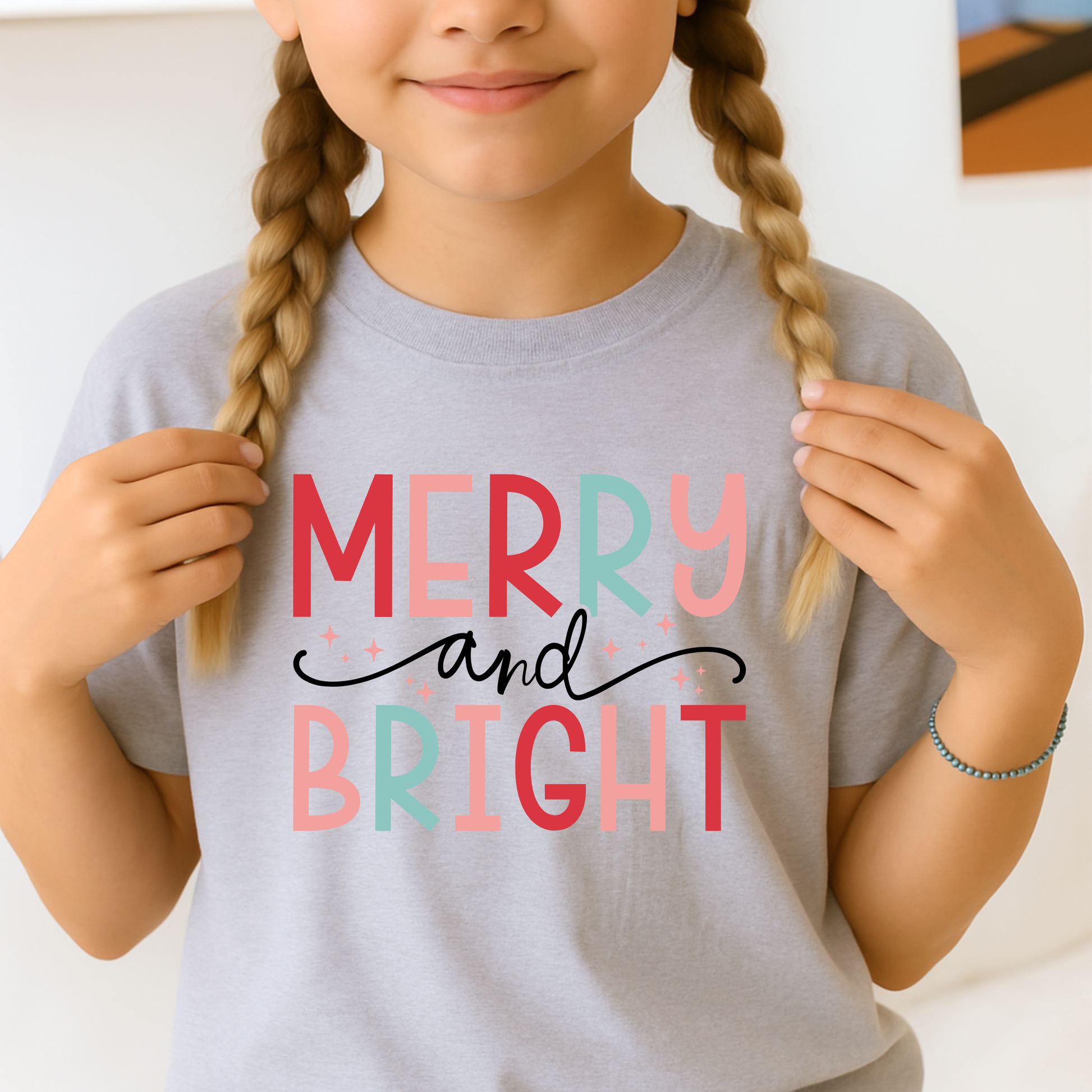 Young Girl wearing a sports gray Merry and Bright Christmas Sweatshirt. 