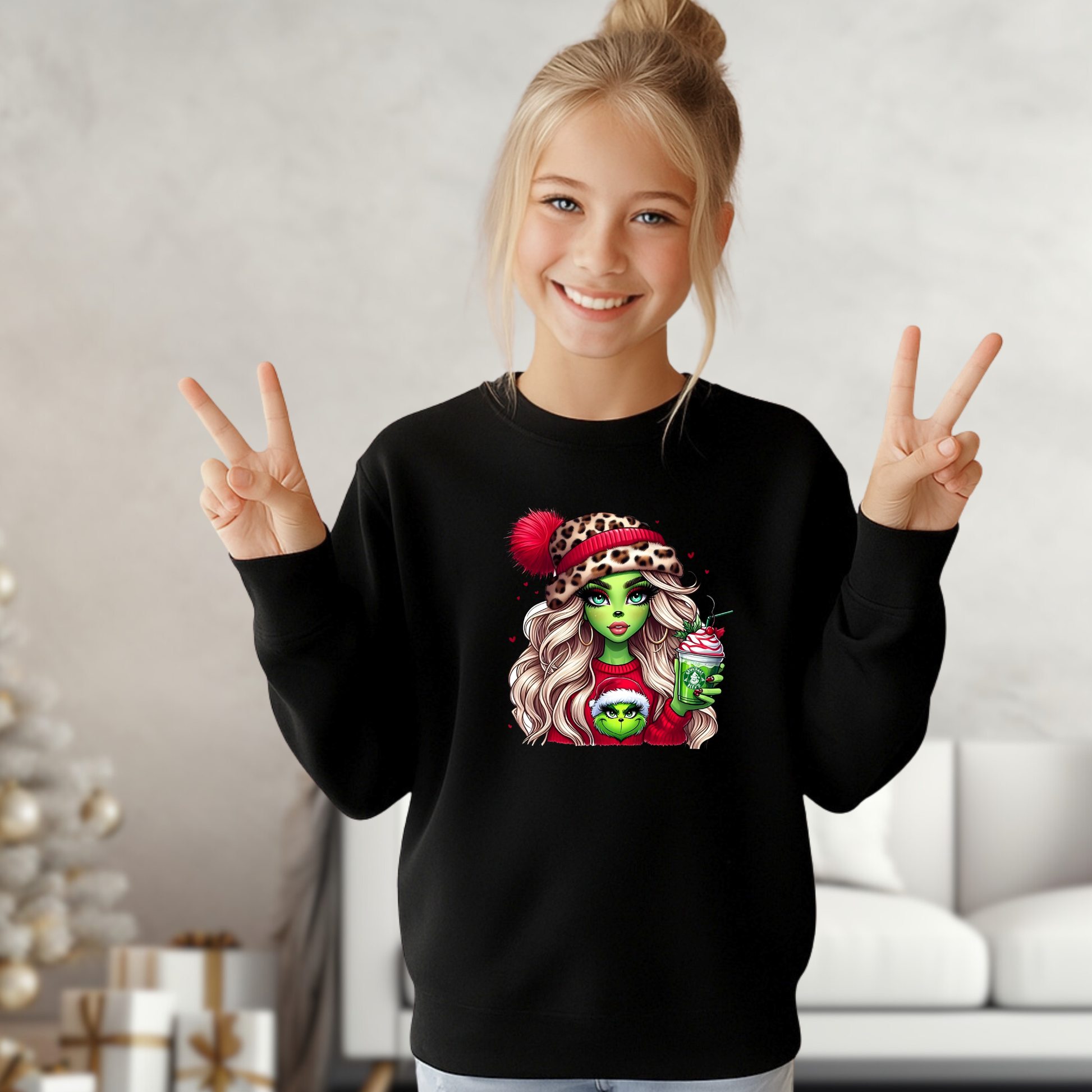 Young girl wearing a black sweatshirt with a graphic design, making peace signs.