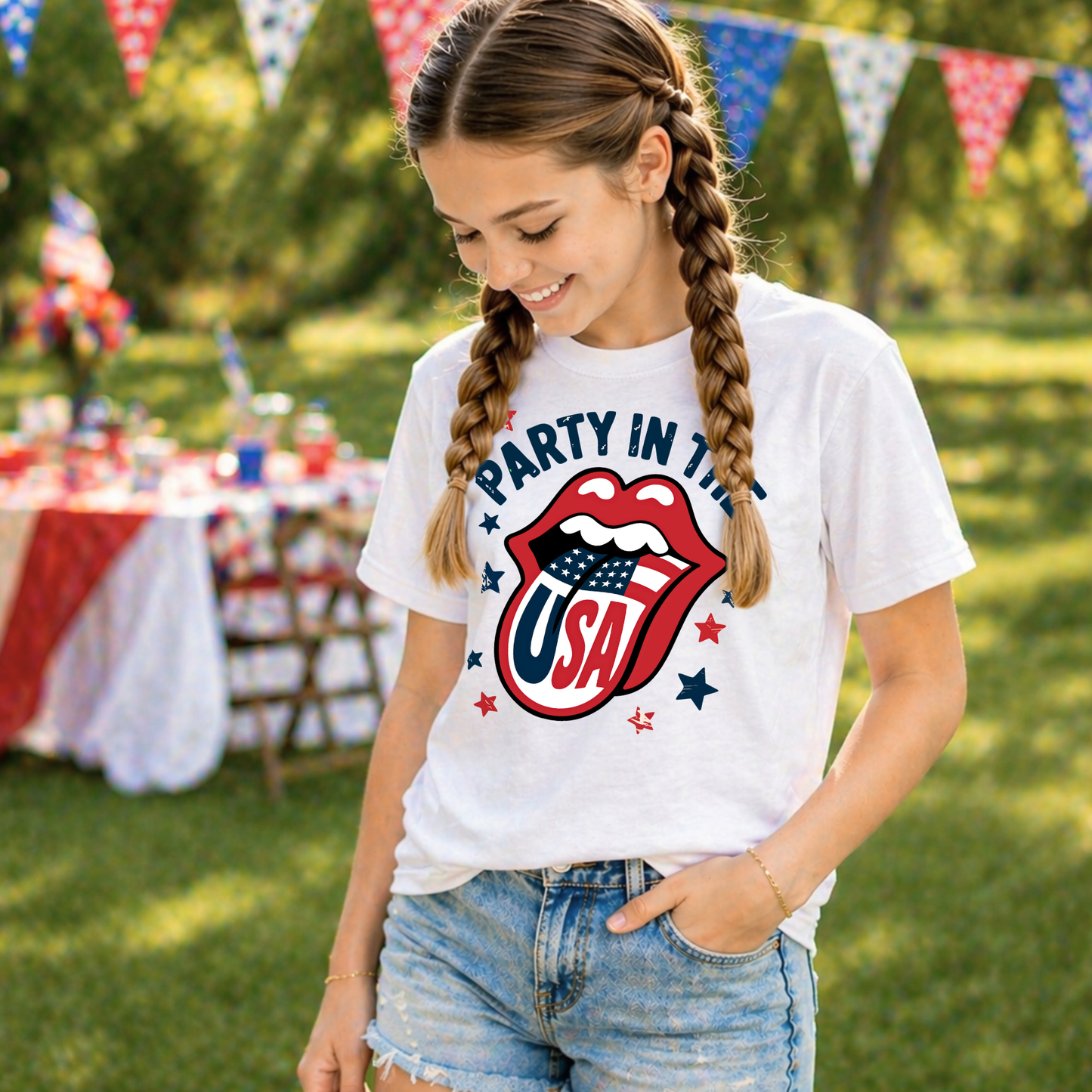 Girl wearing a 'Party in the USA' t-shirt at a 4th of July Celebration. 