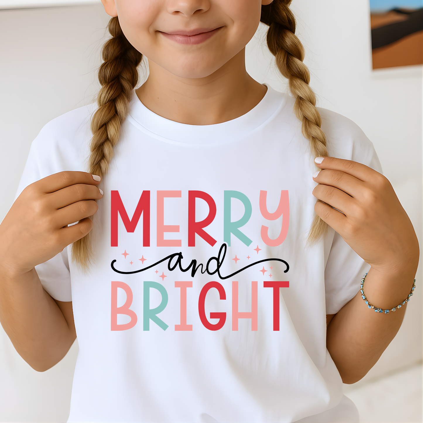 Teen girl wearing white Merry and Bright Christmas T-shirt