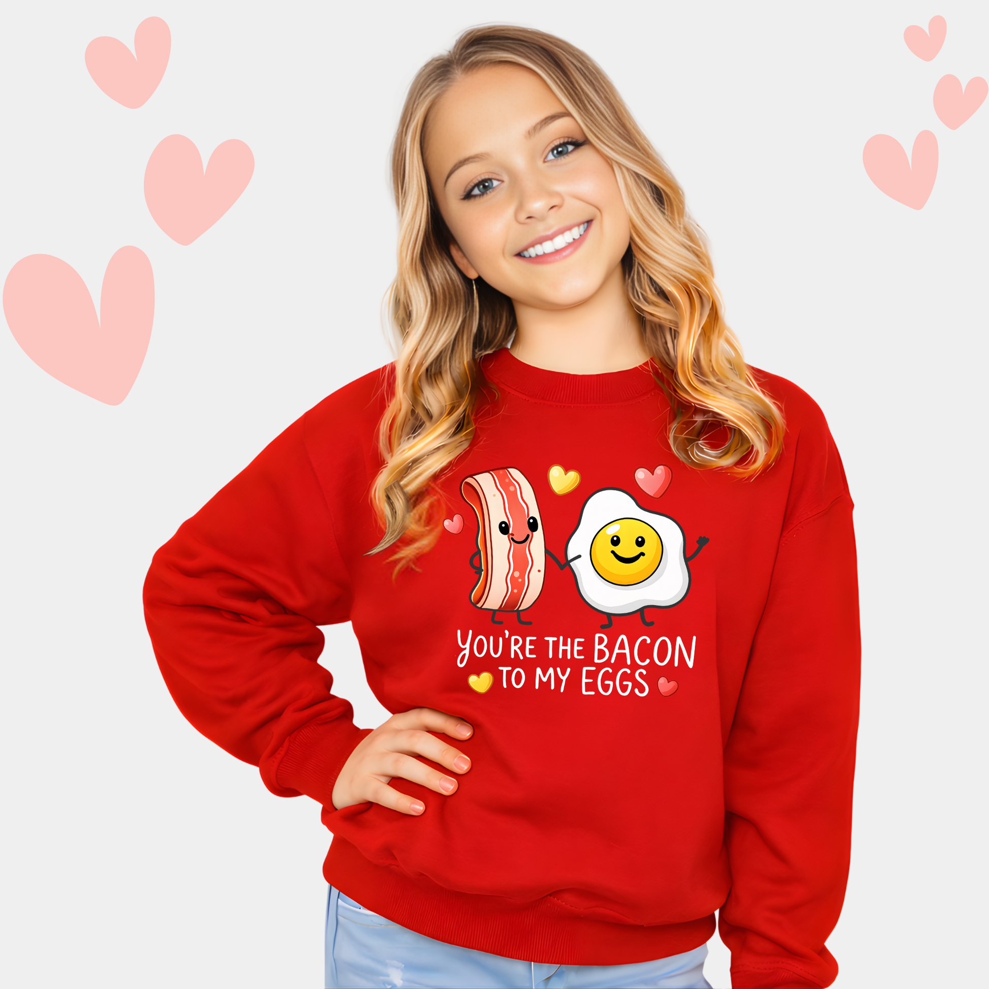 youth girl wearing red valentine sweatshirt with you’re the bacon to my eggs graphic