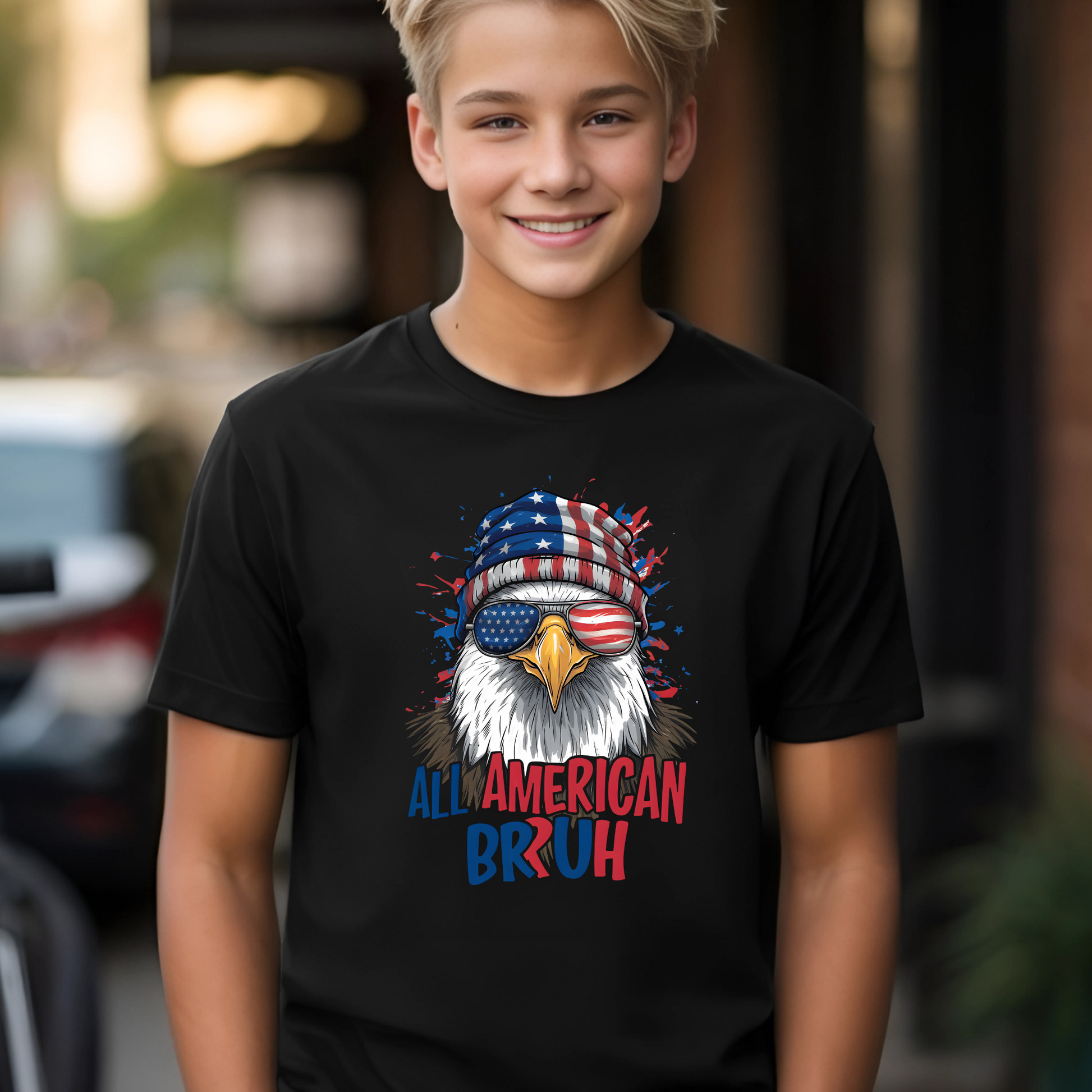 Youth boy wearing black “All American Bruh” t-shirt with patriotic eagle design