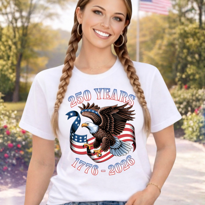 Woman wearing a white t-shirt with an eagle and American flag design, standing outdoors.