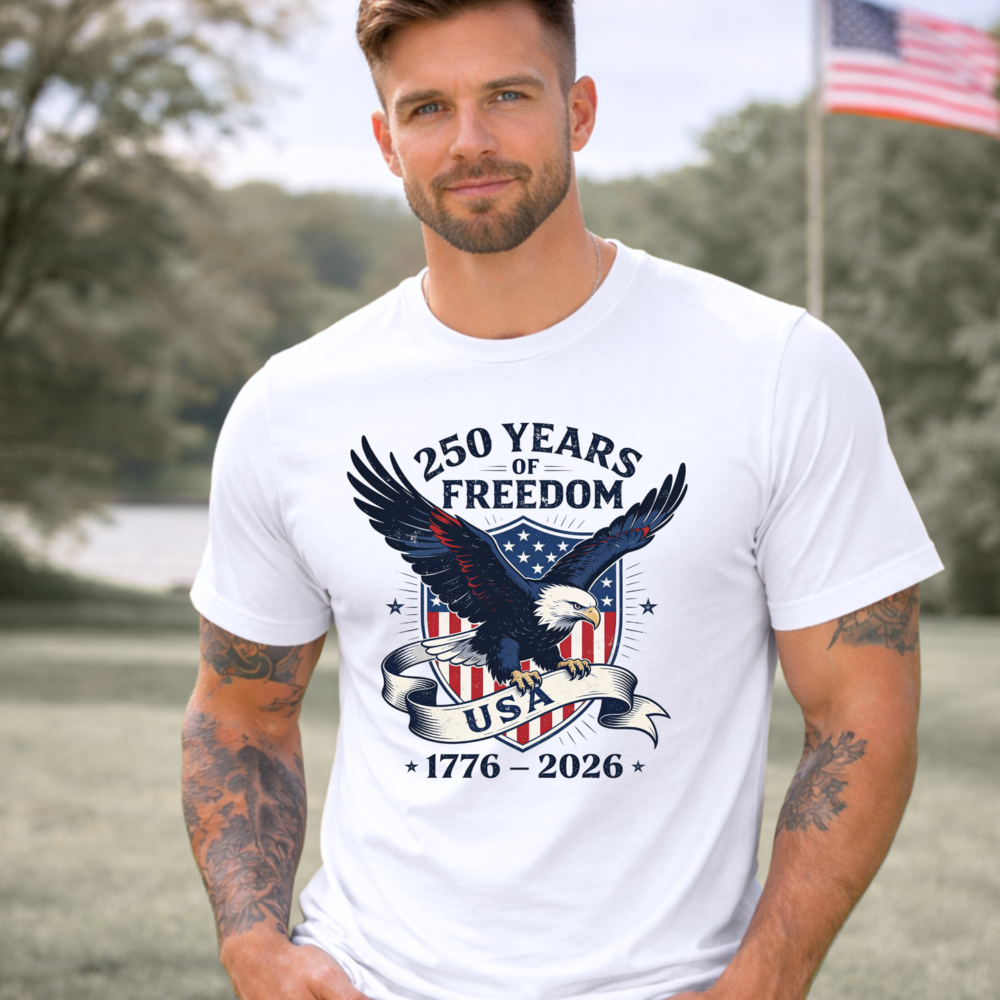 Man wearing a white t-shirt with an eagle graphic and '250 Years of Freedom' text, standing outdoors.