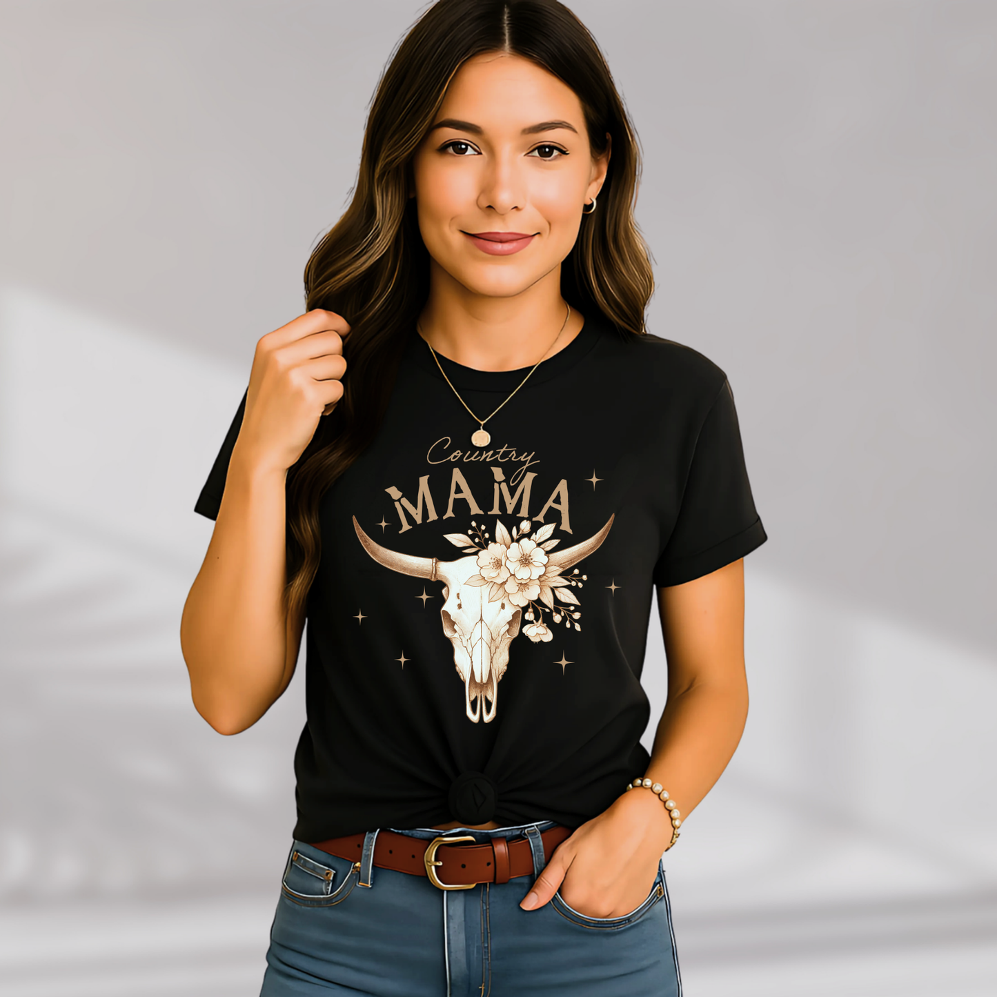 Close-up of knotted black "Country Mama" shirt with accessories

