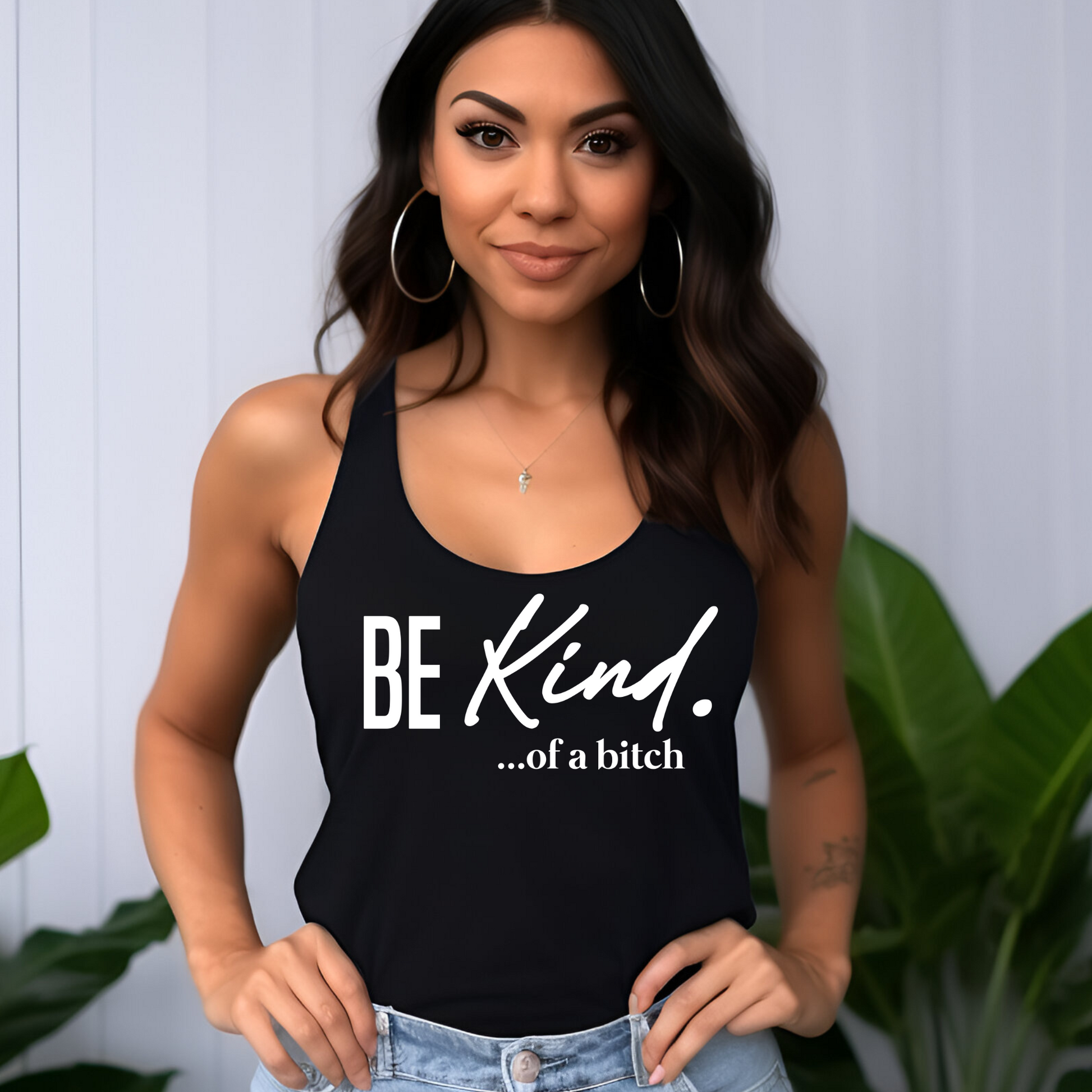 Black racerback tank with sassy “Be Kind…of a bitch” design worn casually
