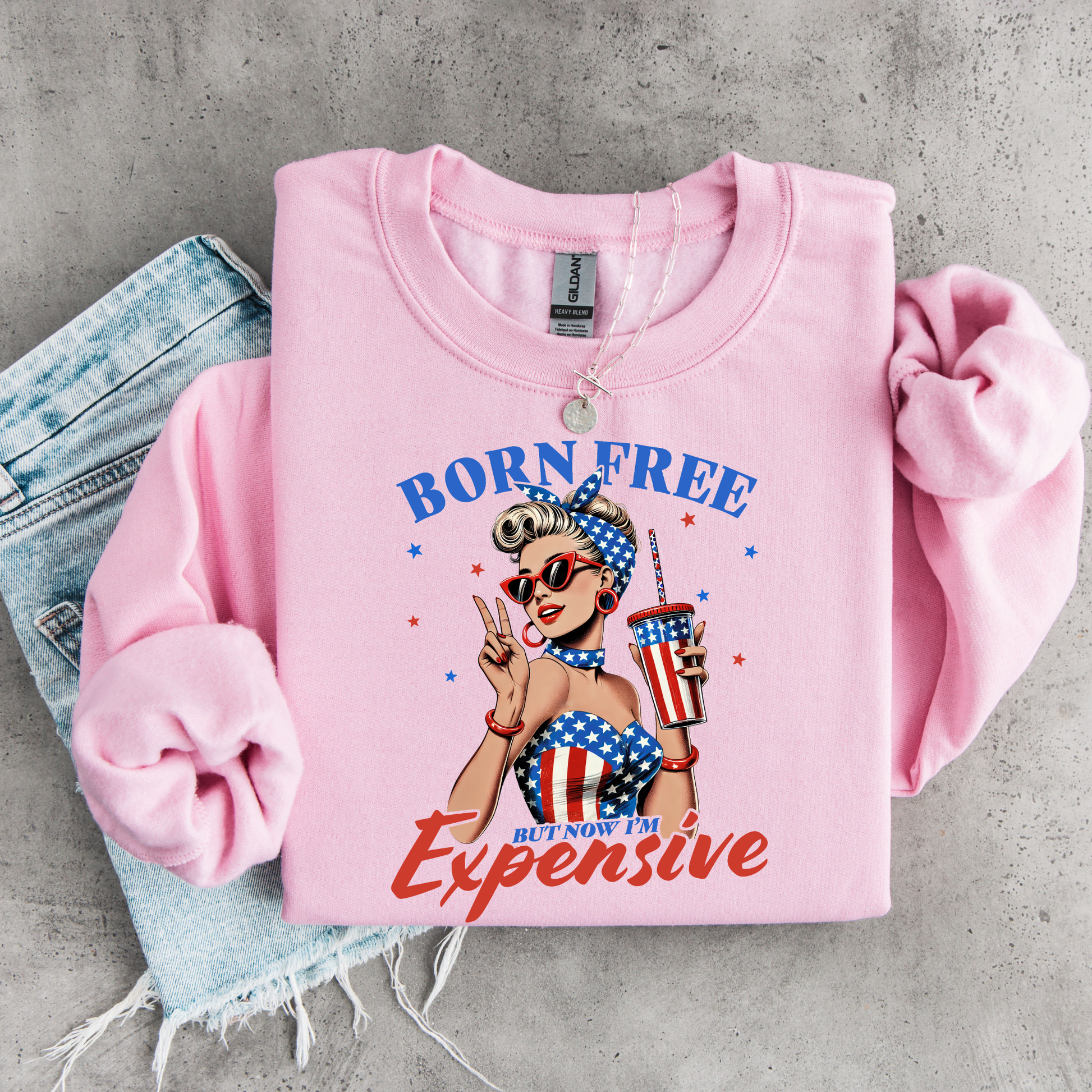 Pink sweatshirt with graphic design, "Born Free but now Im expensive shirt.