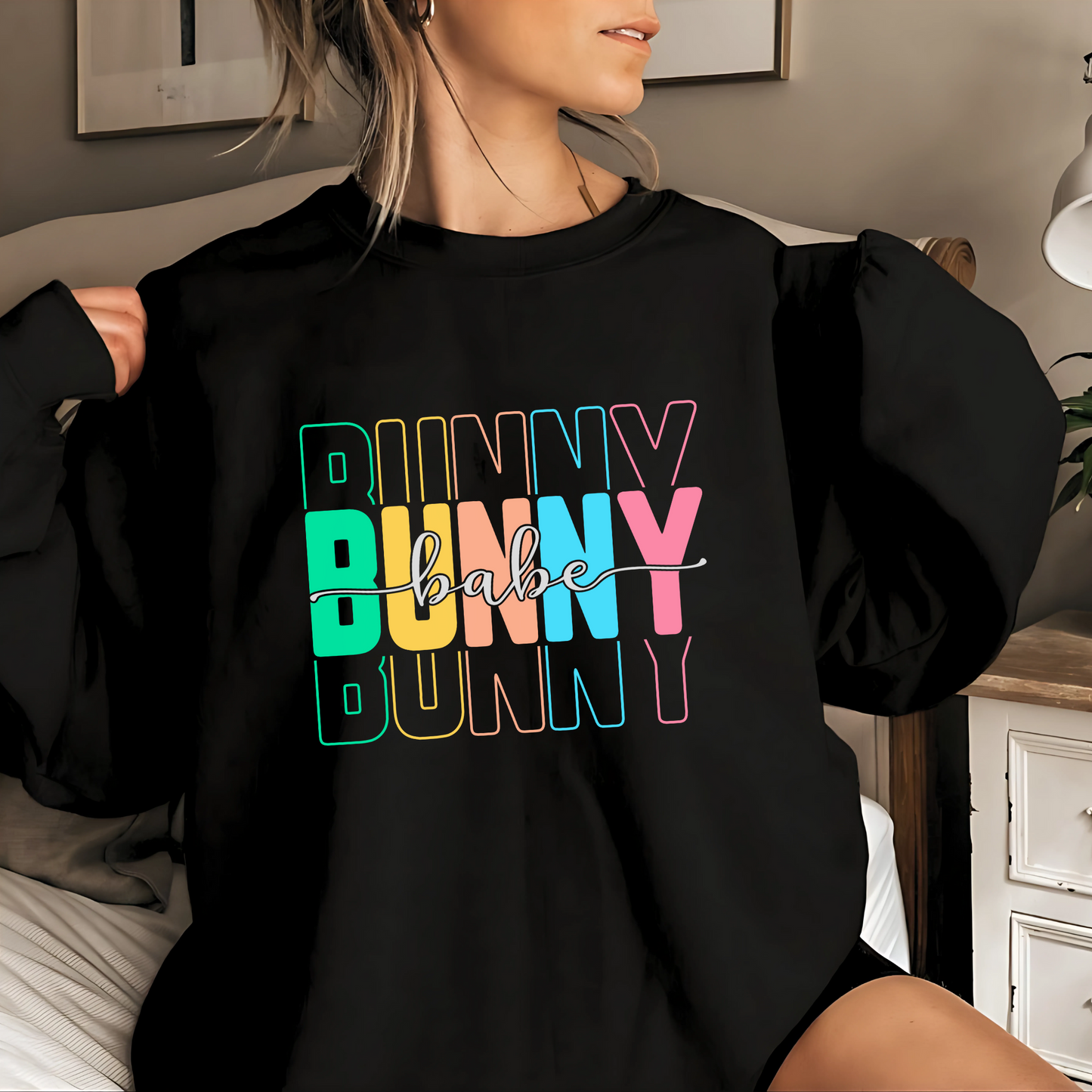 Trendy Bunny Babe oversized sweatshirt with colorful pastel typography, perfect for Easter, spring fashion, and cozy loungewear