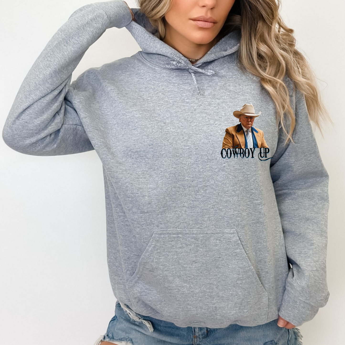 Western-style hoodie featuring a bold “Cowboy Up” graphic with rustic cowboy design. Comfortable casual hoodie for everyday wear