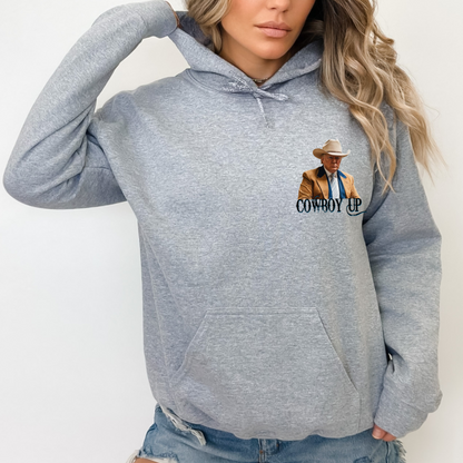 Western-style hoodie featuring a bold “Cowboy Up” graphic with rustic cowboy design. Comfortable casual hoodie for everyday wear