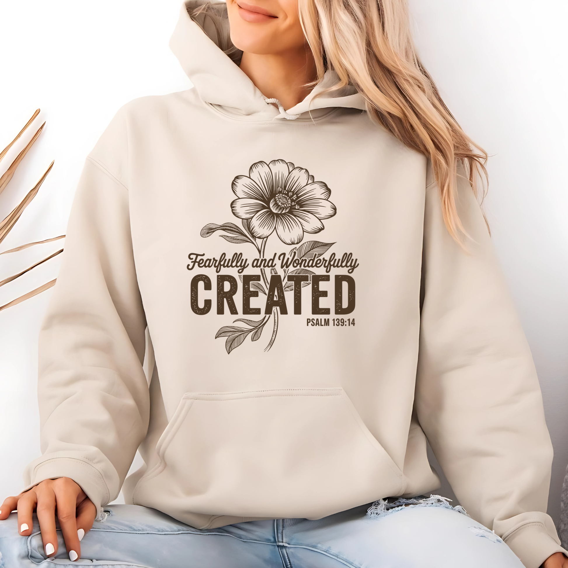 Brown t-shirt with Fearfully and Wonderfully Created floral design on hanger