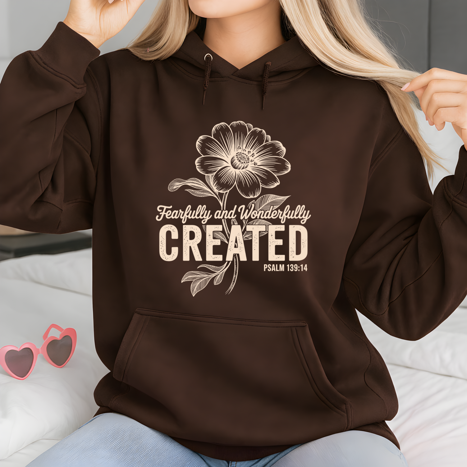 Brown sweatshirt with Fearfully and Wonderfully Created floral design flat lay with accessories