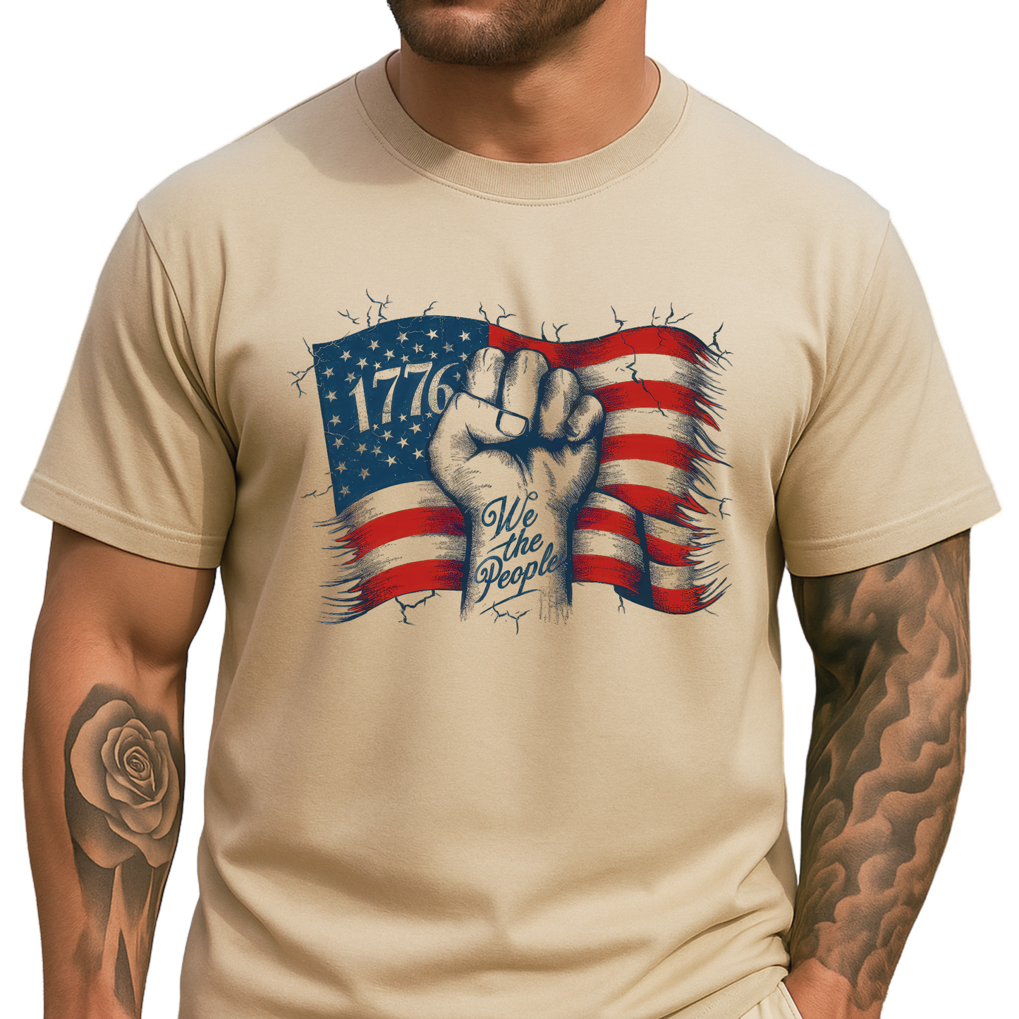 Man in sand 1776 shirt with American flag design and tattooed arm
