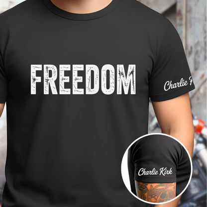 Black t-shirt with 'FREEDOM' text worn by a person, with a close-up of the brand logo on a red background.