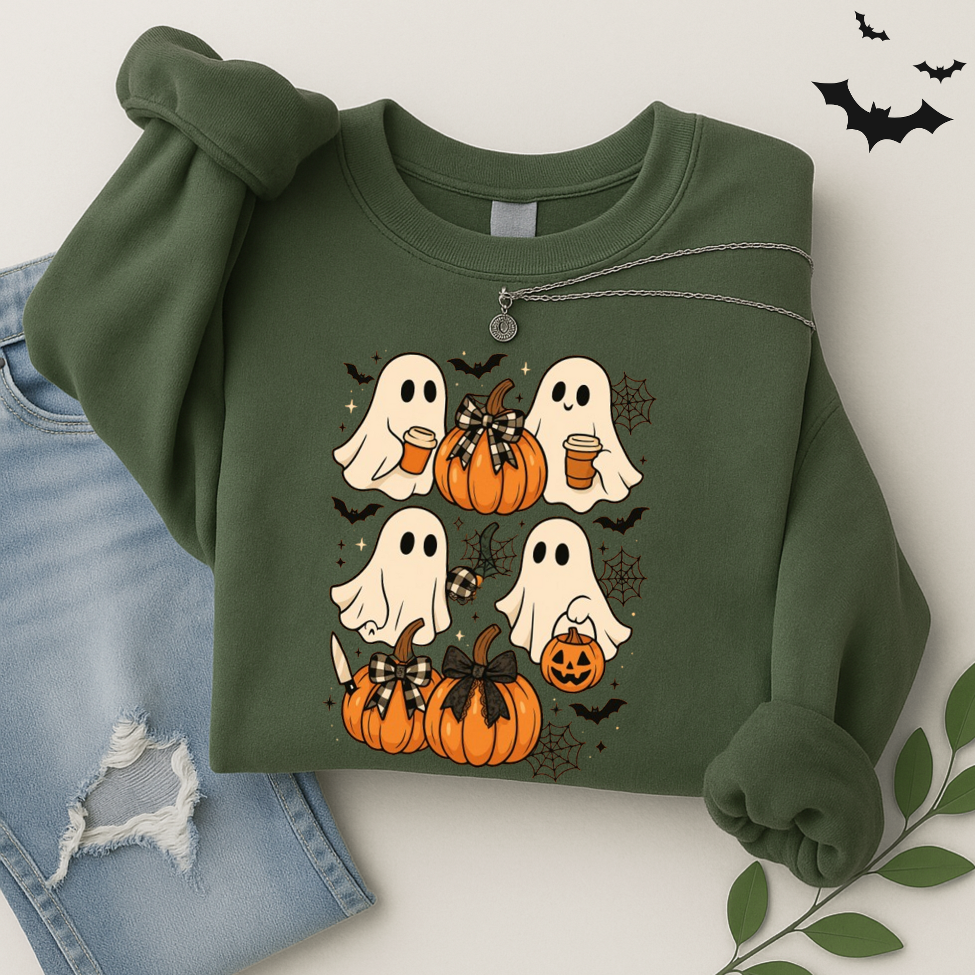 green Halloween ghost sweatshirt with pumpkins and cobweb accents. Cozy autumn crewneck for women who love fall fashion, pumpkin patches, and Halloween fun