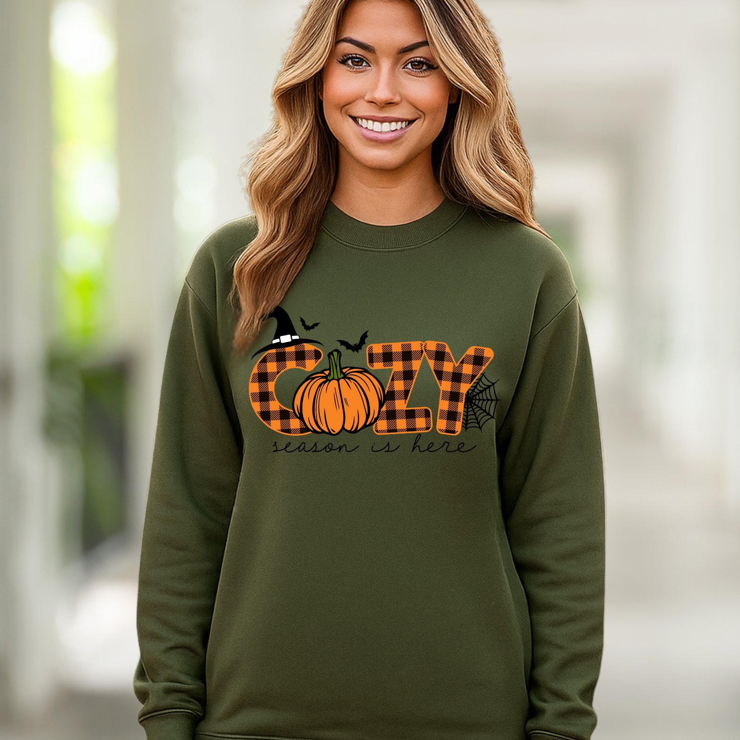 green sweatshirt featuring autumn buffalo plaid and pumpkin design, smiling woman

