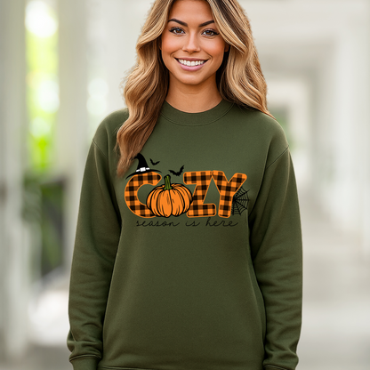 green sweatshirt featuring autumn buffalo plaid and pumpkin design, smiling woman

