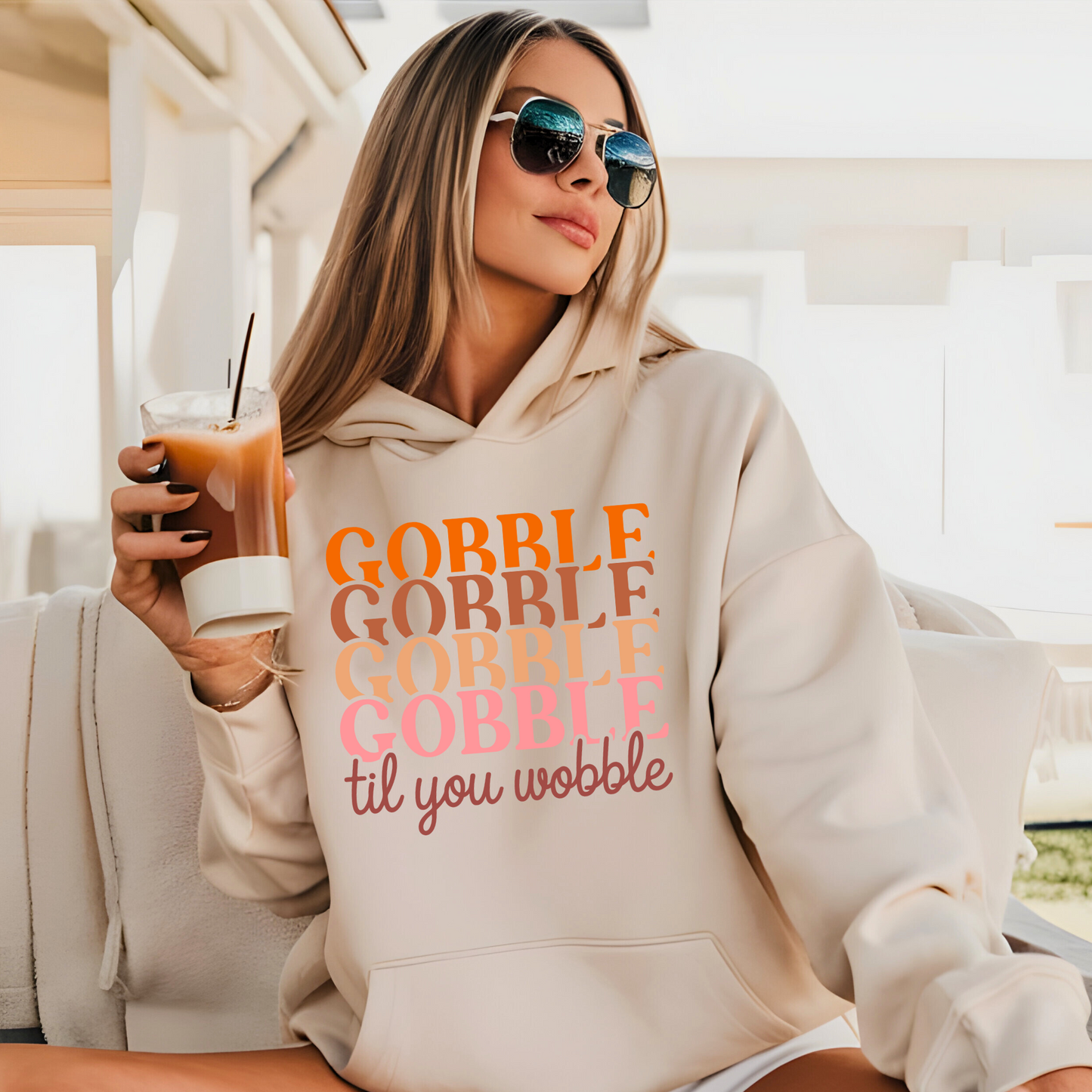 Cream hoodie with sunglasses and coffee – stylish fall outfit with Thanksgiving vibe