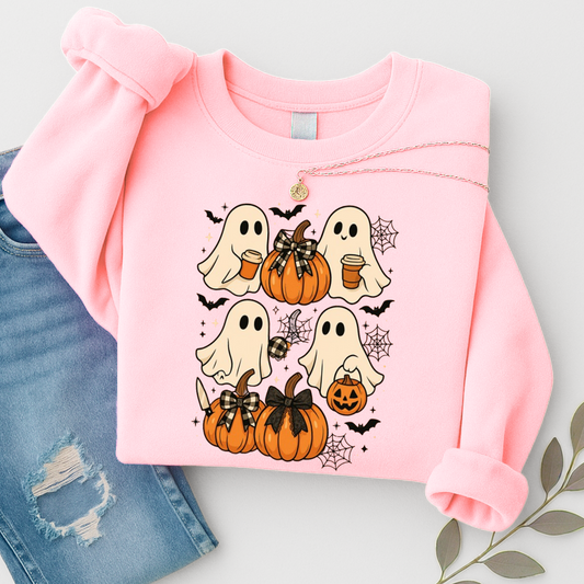 ight pink Halloween sweatshirt with four cute ghost illustrations, pumpkins with bows, bats, and spider webs. A cozy fall pullover for women who love pastel spooky season vibes