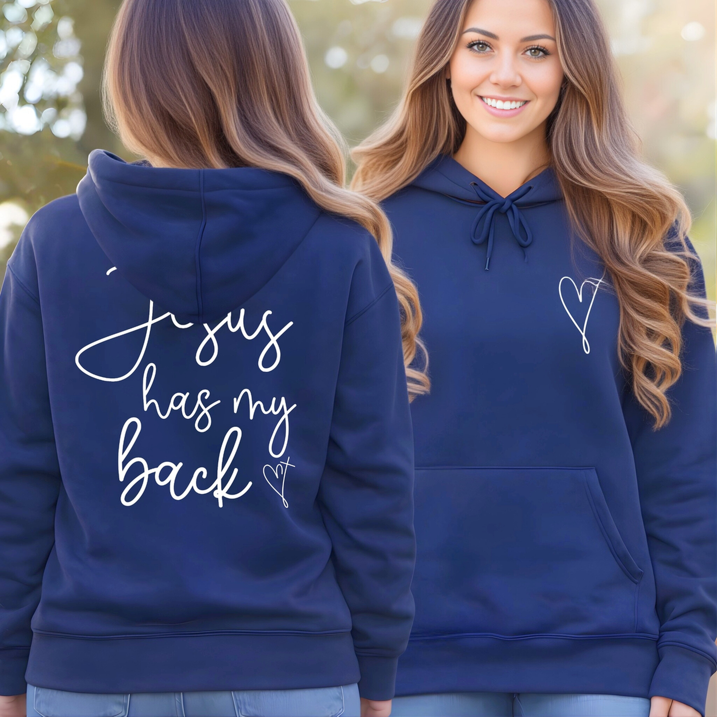 Navy blue hoodie with text on the back and a heart design on the front, worn by a person outdoors.