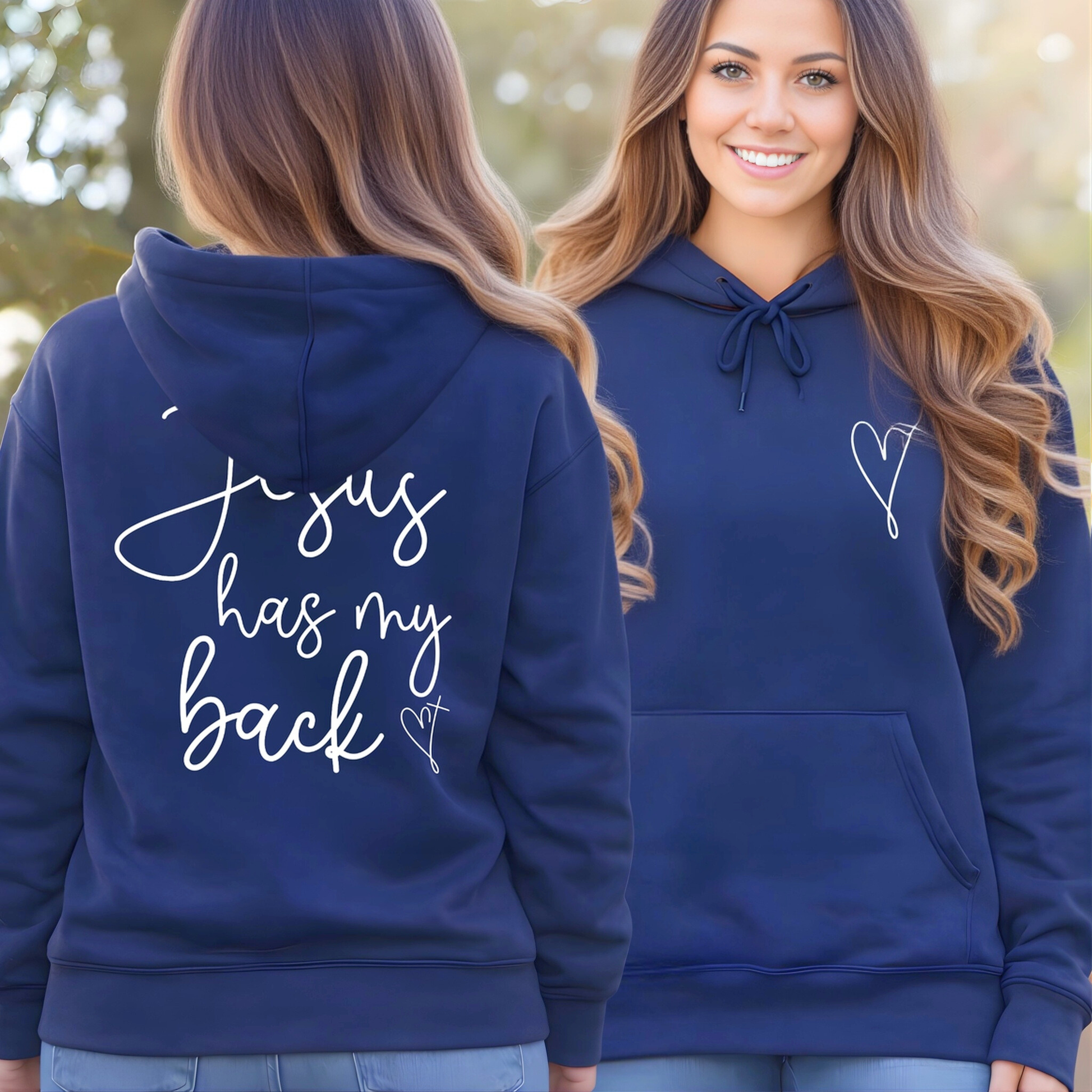 Navy blue hoodie with text on the back and a heart design on the front, worn by a person outdoors.