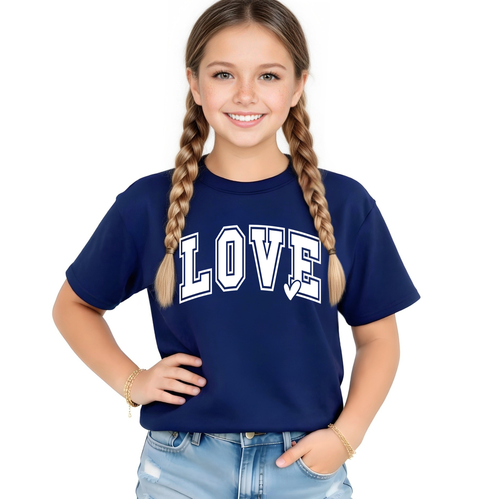 Youth girl wearing a navy blue LOVE graphic t-shirt with white varsity lettering, paired with light wash denim shorts