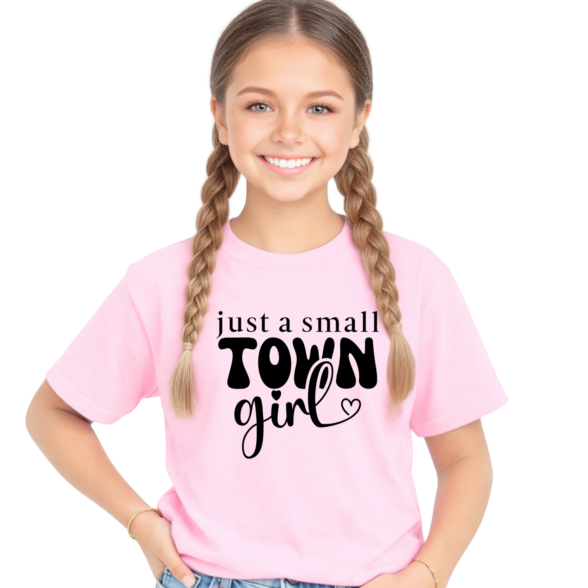 Young girl wearing a pink t-shirt with 'just a small town girl' text on a white background