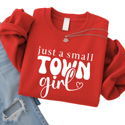 Red sweatshirt with 'just a small town girl' text on a white background
