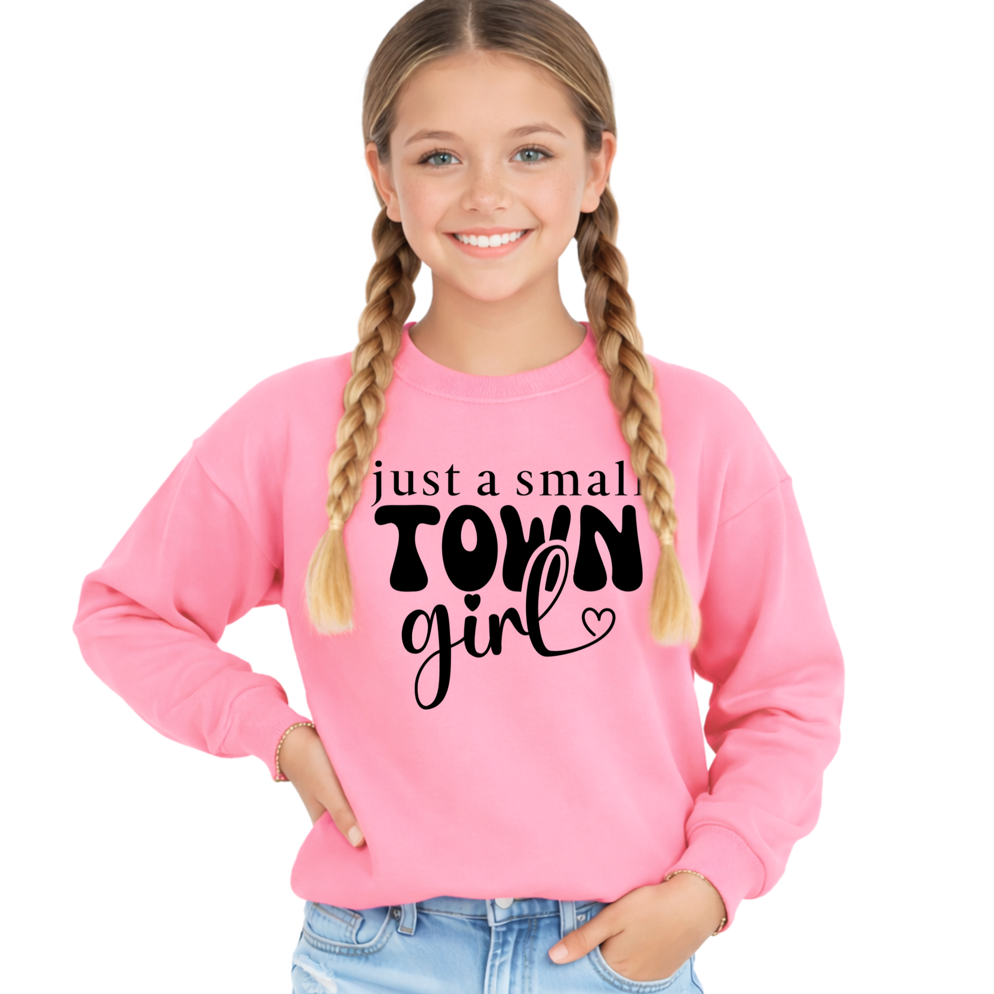 Young girl wearing a pink sweatshirt with 'just a small town girl' text on a white background