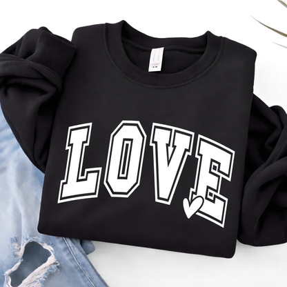 Black LOVE graphic sweatshirt flat lay with white varsity lettering and heart accent, styled with denim, cozy youth Valentine clothing, trendy kids apparel product image