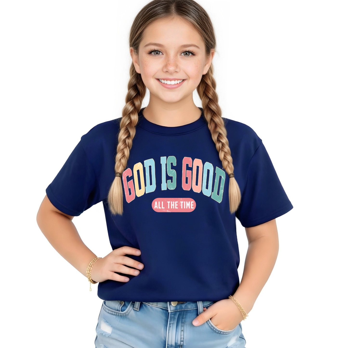 Young girl wearing a navy blue t-shirt with 'GOD IS GOOD ALL THE TIME' text on a white background
