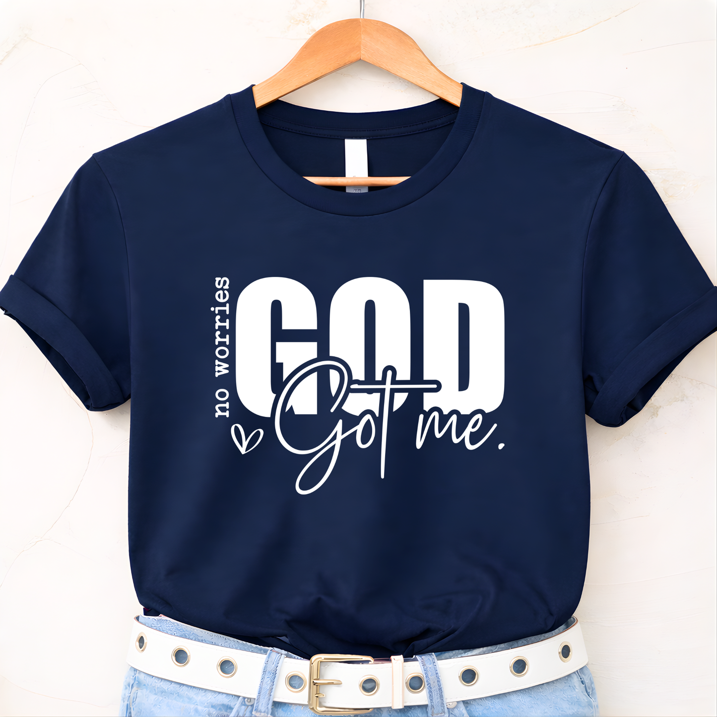 Black Christian flat-lay T-shirt on hanger