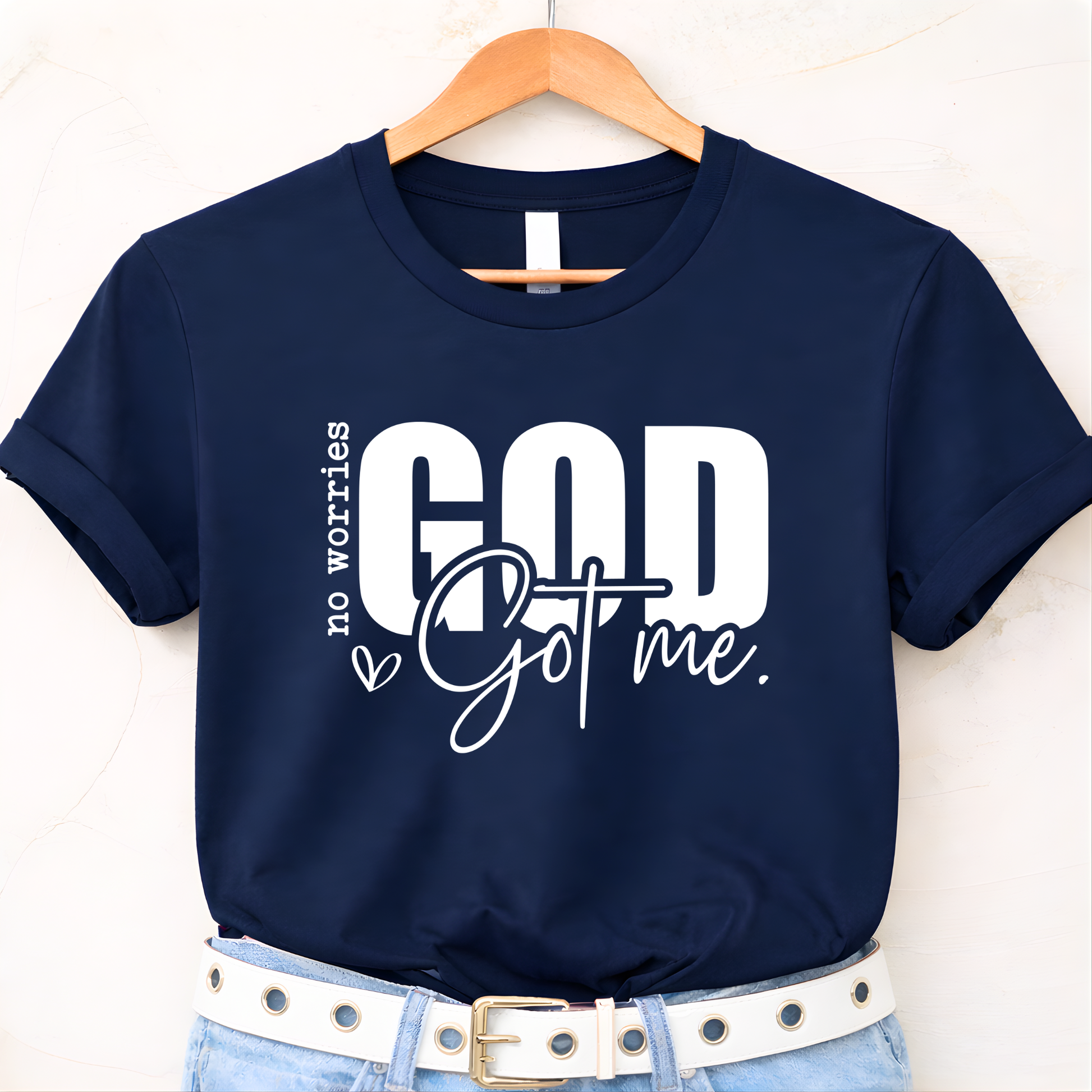 Black Christian flat-lay T-shirt on hanger