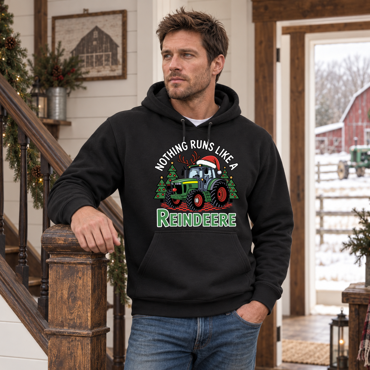 Man in a black Nothing Runs Like a Reindeere hoodie by a farmhouse staircase with a snowy farm outside.