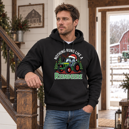 Man in a black Nothing Runs Like a Reindeere hoodie by a farmhouse staircase with a snowy farm outside.