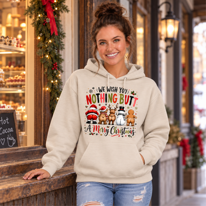 Woman wearing a sand hoodie with We Wish You Nothing Butt a Merry Christmas design with rear-view Santa, bear, reindeer, snowman and gingerbread characters outside a decorated holiday bakery