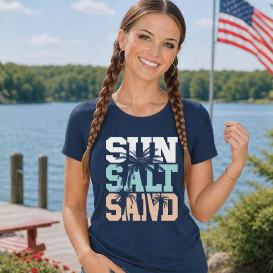 Video of woman wearing Sun salt sand tshirt on by the lake
