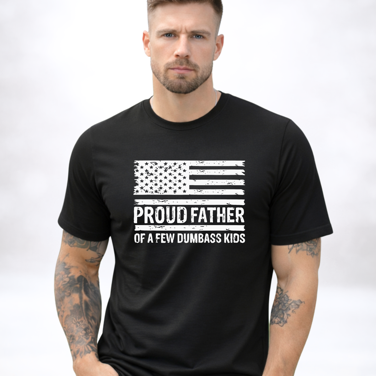 Man wearing a black t-shirt with text and an American flag graphic, "Proud Father" text