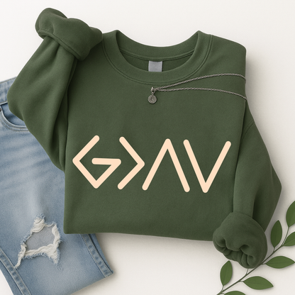 Green sweatshirt folded displaying gold God Is Greater Than the Highs and Lows front design