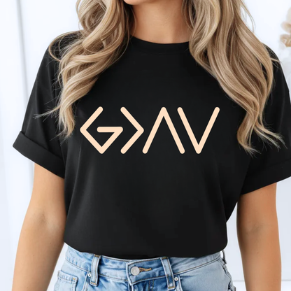 Black short sleeve t-shirt worn by model featuring gold God Is Greater Than the Highs and Lows front design