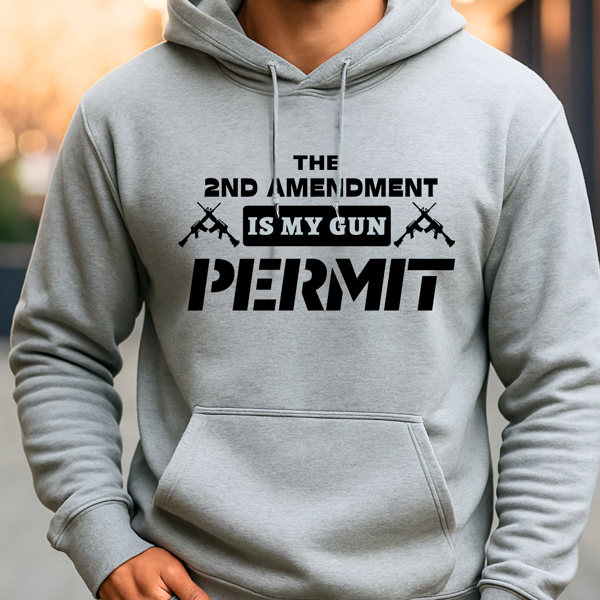 Gray hoodie with text 'The 2nd Amendment is my gun permit' on a blurred background