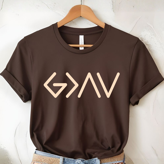 Brown short sleeve t-shirt on hanger featuring gold God Is Greater Than the Highs and Lows front design