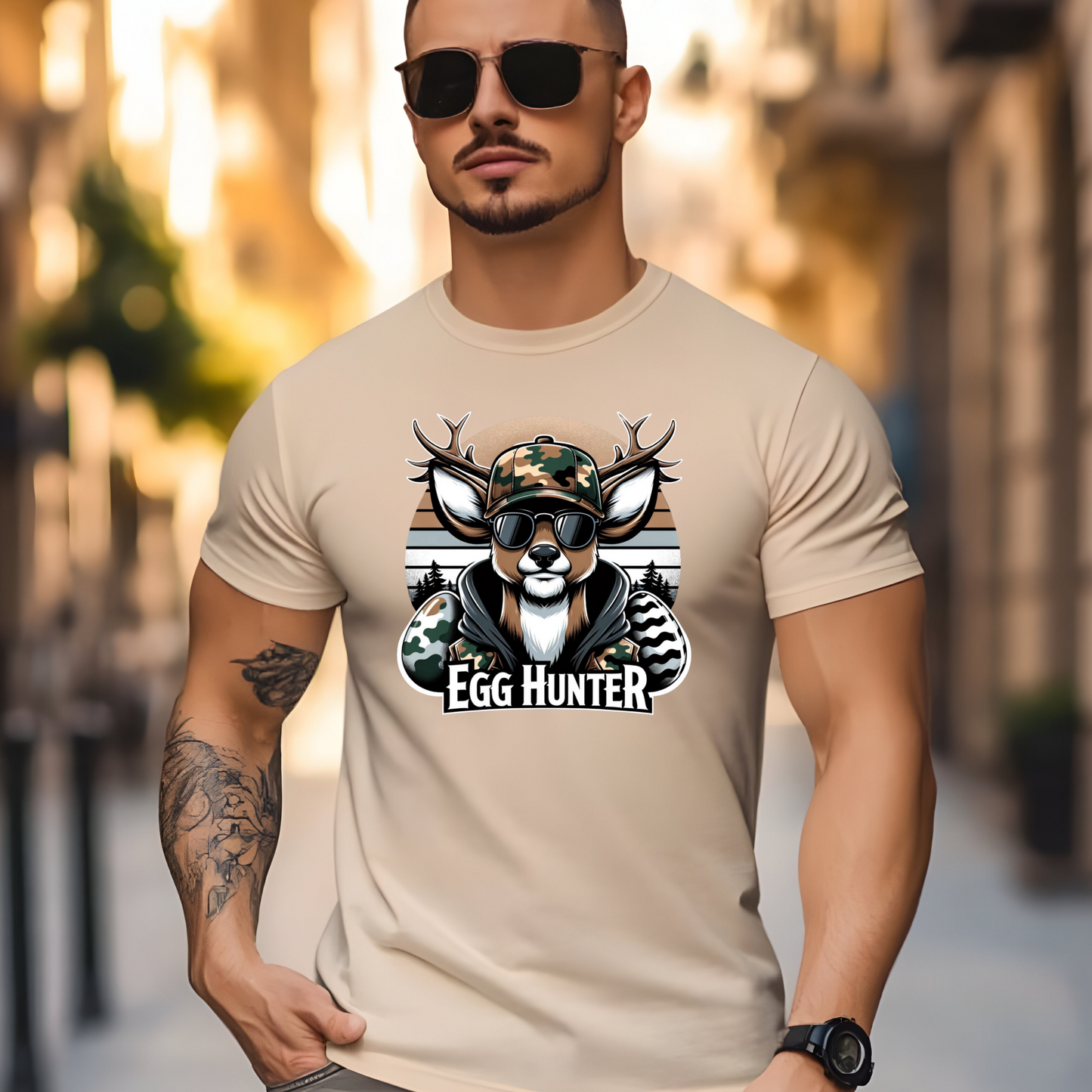Sand-colored Egg-Hunter-Shirt featuring a stylish camo deer and egg design, great for Easter egg hunts and hunting trips.