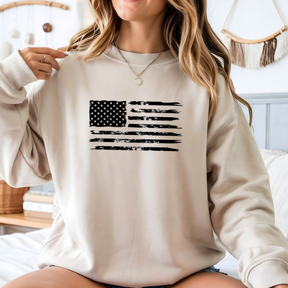 Person wearing a beige sweatshirt with an American flag design.