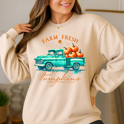 sand colored pumpkin patch sweatshirt modeled in a fall harvest setting